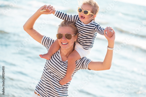 Mother with daughter on the beach