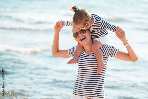 Mother with daughter on the beach
