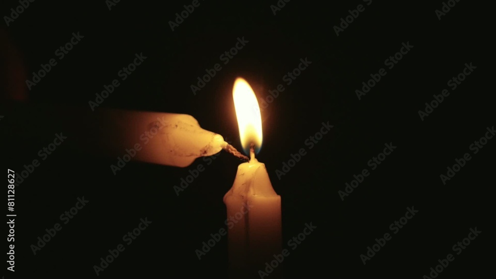 Candle being lit in slow motion Stock Video Adobe Stock