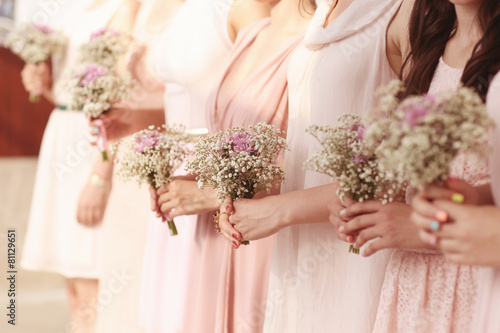 Photography Hands of bridesmaid holding a beautiful gypsophila bouquet