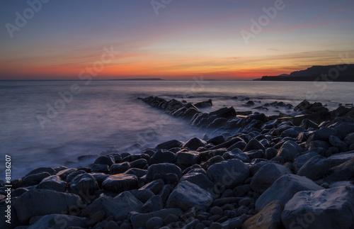 Kimmeridge Bay with wet rocks and sunset © Donna White