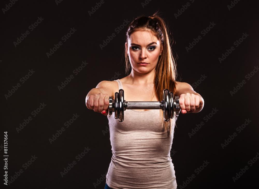 athletic woman working with heavy dumbbells athletic woman working with heavy dumbbells