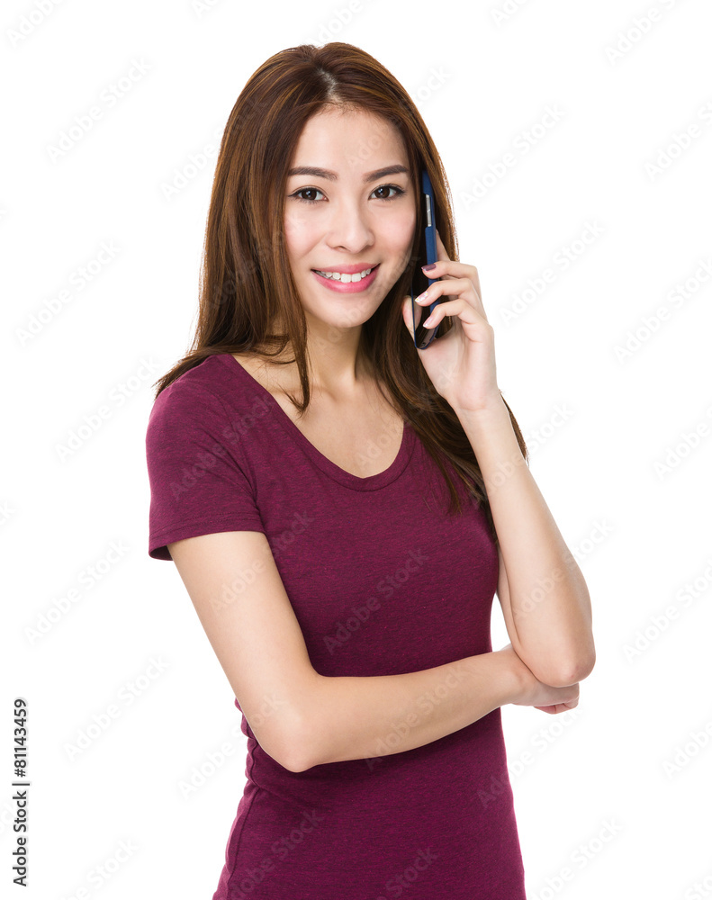 Woman talking with cellphone and smiling Woman talking with cellphone and smiling