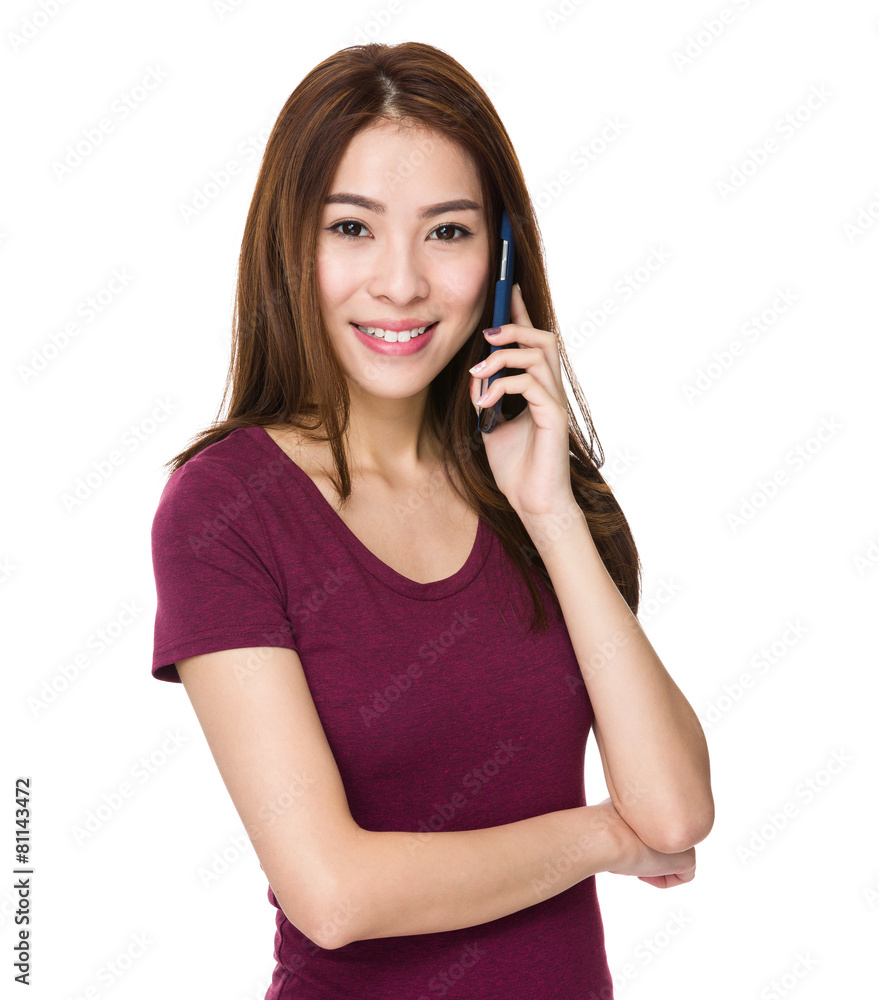 Woman talking with cellphone and smiling Woman talking with cellphone and smiling