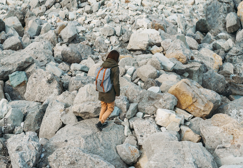 Woman walking on stones