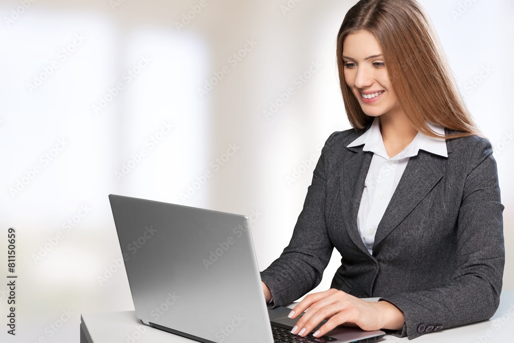 Network. Beautiful young lady sitting at desk and typing on Network. Beautiful young lady sitting at desk and typing on