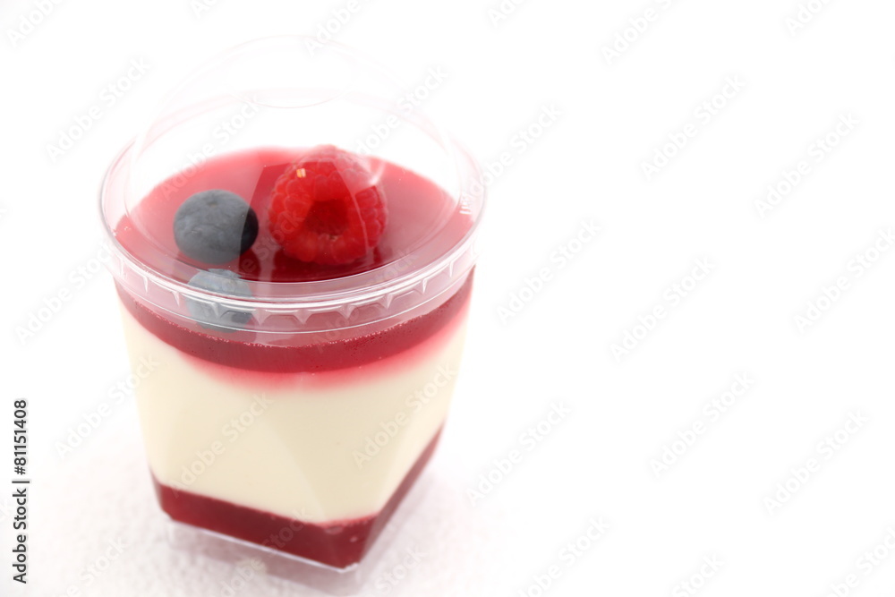 Delicate raspberry panacotta decorated with fresh fruit. Delicate raspberry panacotta decorated with fresh fruit.
