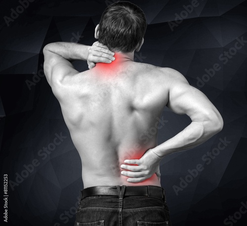 Obraz na plátně Pain. A boy felt back pain on white background