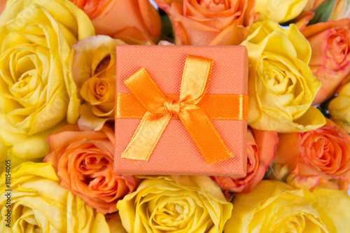little gift box and beautiful bouquet of roses