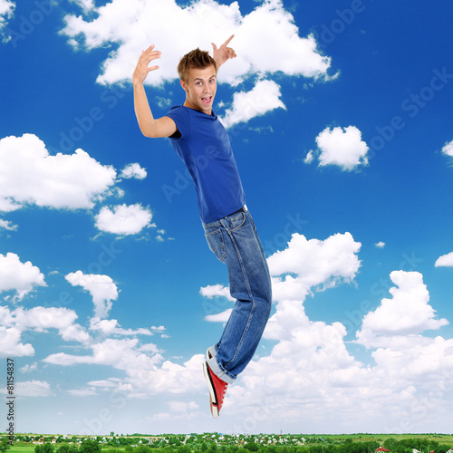Jumping guy on sky background