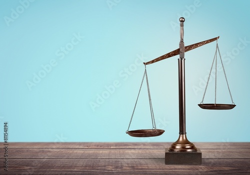 Lawyer. Law scales on table in front black background. Symbol of