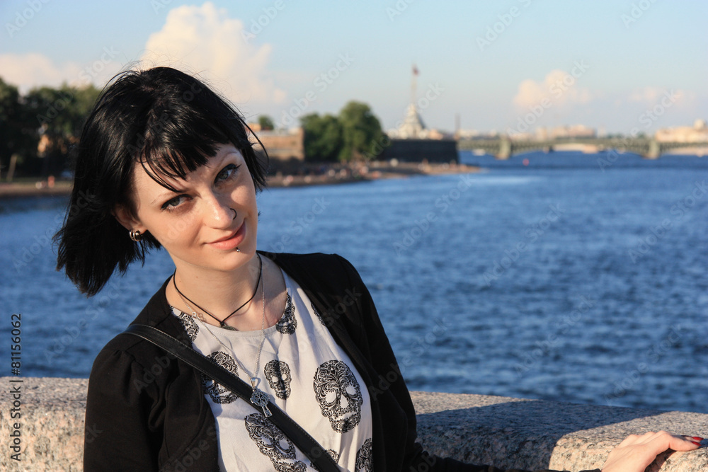 Portreit of pretty girl on Peterburg embankment