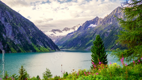 Lake and mountains at cloudy weather photo