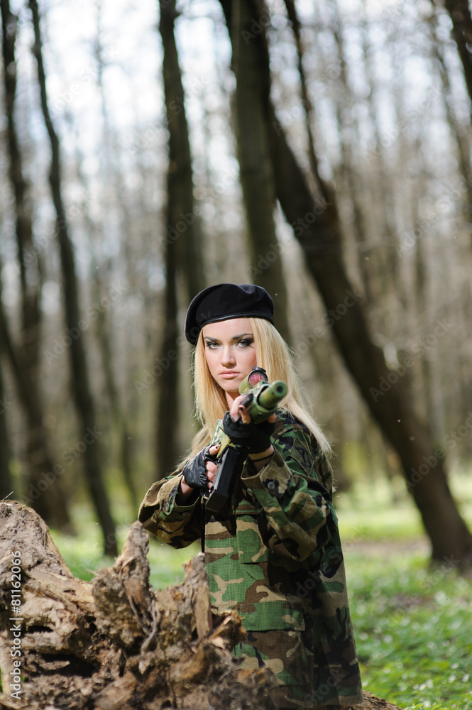 Beautiful army girl with gun