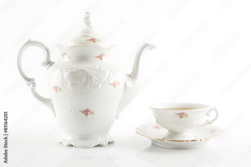 Old-style retro jug with tea on white background Old-style retro jug with tea on white background