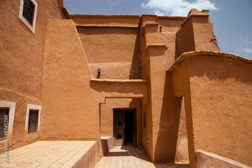 Kasbah repaired wall with windows and ornaments, Morocco