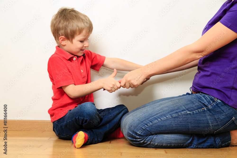 computer addiction, parent taking out touch pad from child