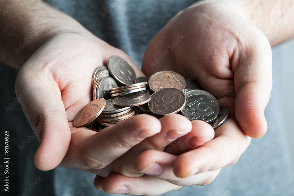 five-ruble coin in man's hands