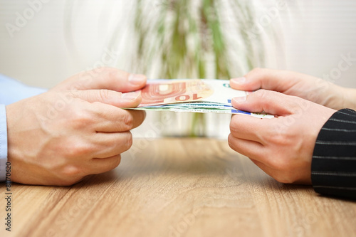 man and woman are fighting over money