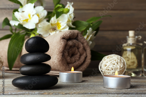 Beautiful spa composition with stones and flowers