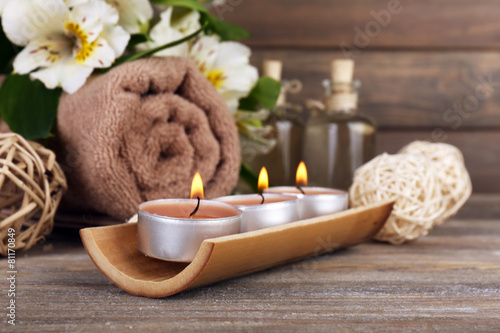Beautiful spa composition with candles and flowers