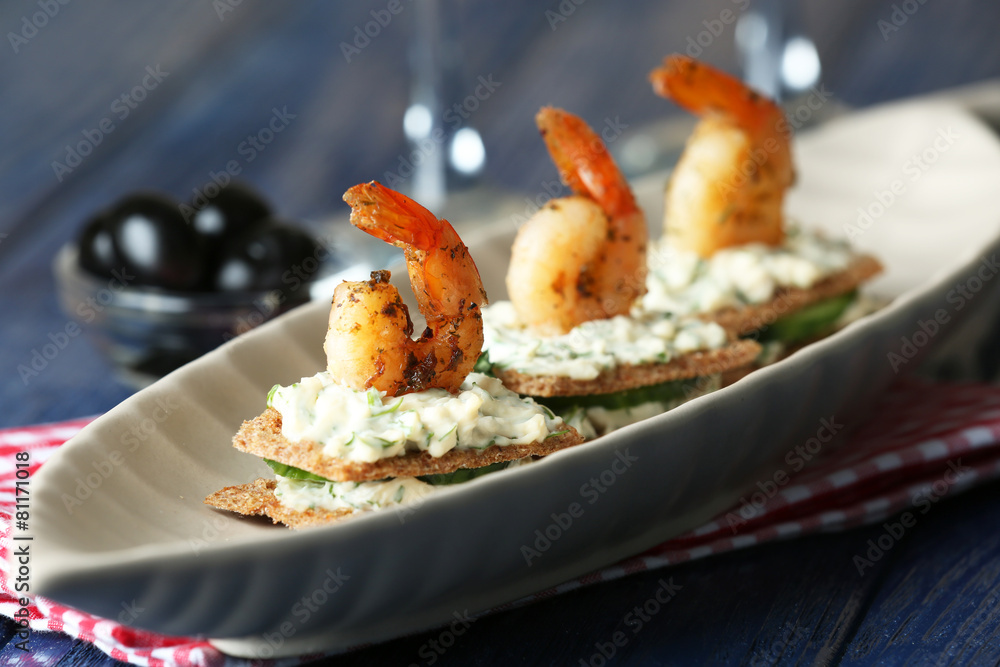 Appetizer canape with shrimp and cucumber