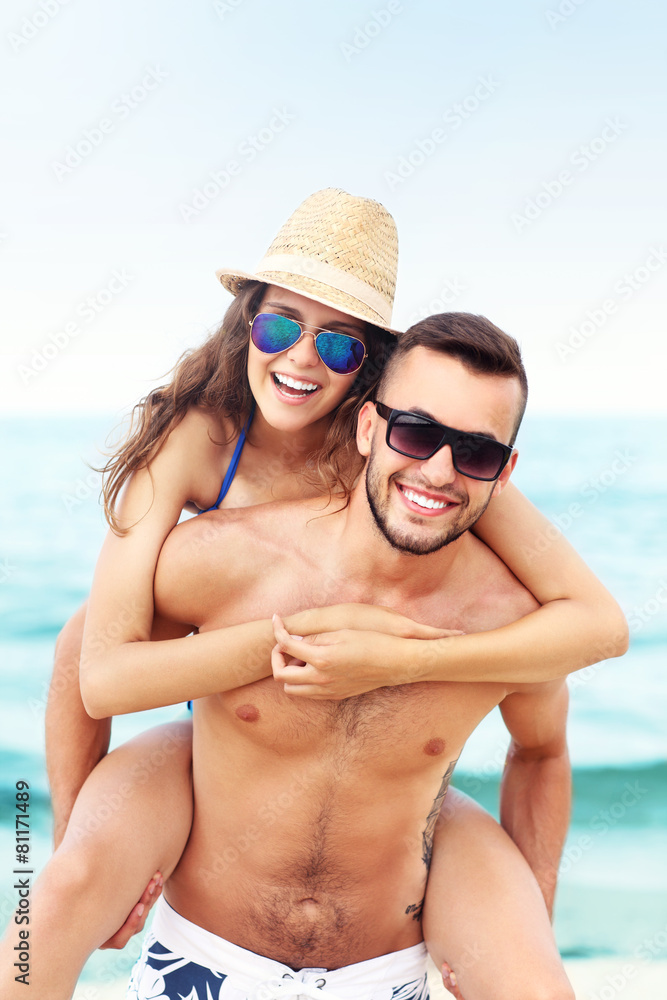 Fototapeta premium Happy couple having fun at the beach