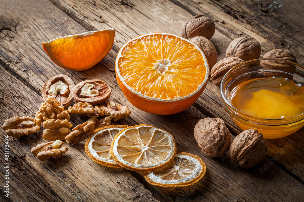Walnut kernels and whole walnuts with orange Walnut kernels and whole walnuts with orange