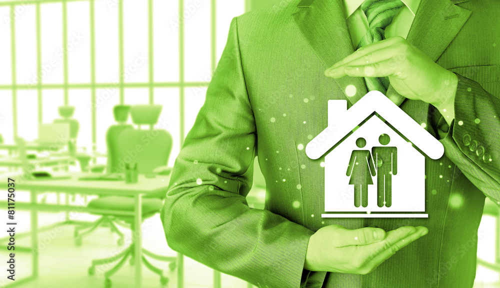 businessman protecting family in home with hands businessman protecting family in home with hands