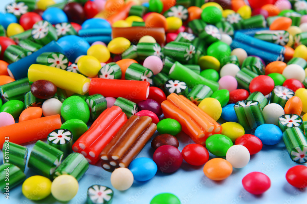 Colorful candies on light blue background Colorful candies on light blue background