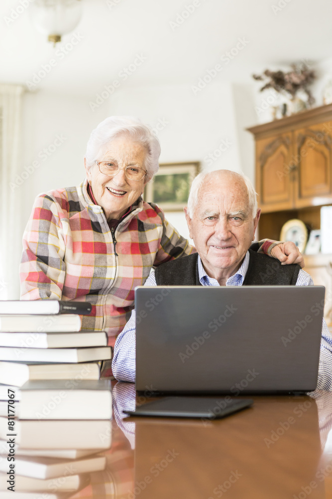 Senior couple working with Laptop at home