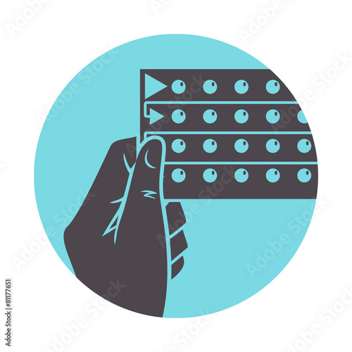 Hand holding birth control pills