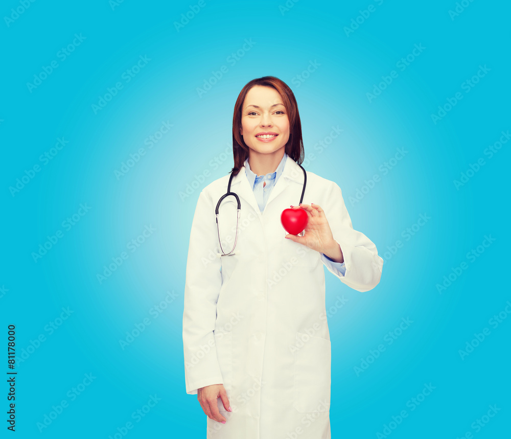 smiling female doctor with heart and stethoscope smiling female doctor with heart and stethoscope