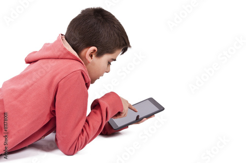 child with tablet isolated on white © carballo