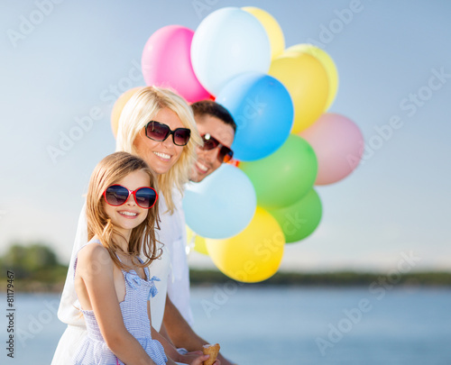 family with colorful balloons © Syda Productions
