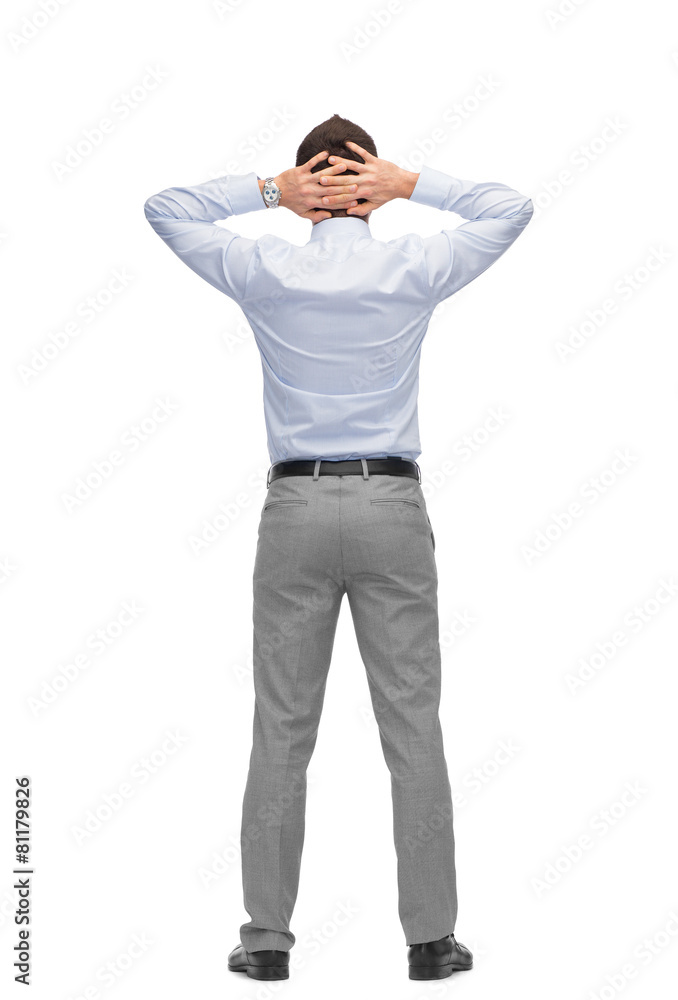 businessman with hands behind his head from back businessman with hands behind his head from back