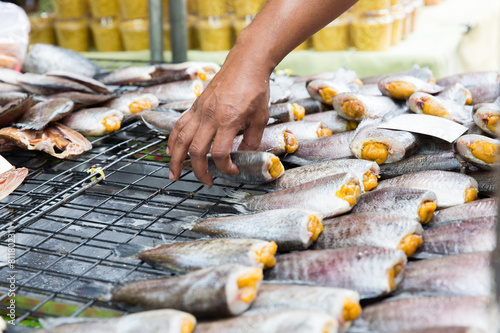 close up of hand taking fish at street market