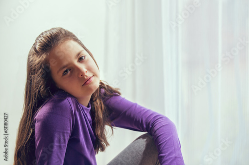 Ten year old caucasian girl with long hair posing photo