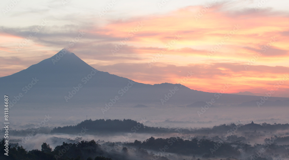 Colorful sunrise with Merapi volcanoand Borobudur temple