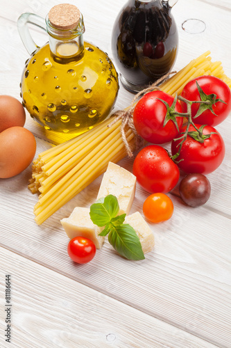 Italian food cooking ingredients. Pasta, tomatoes, basil