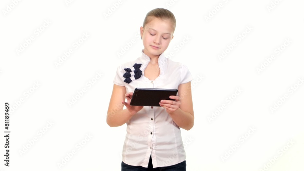 School girl looking for something using tablet computer, on School girl looking for something using tablet computer, on