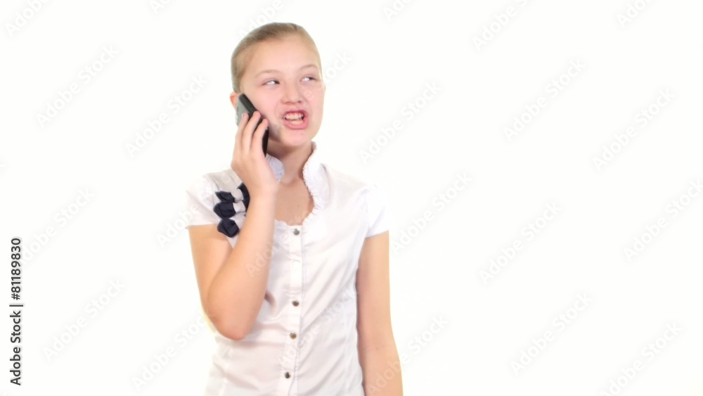 School girl using mobile phone and calls somebody, smiles on School girl using mobile phone and calls somebody, smiles on