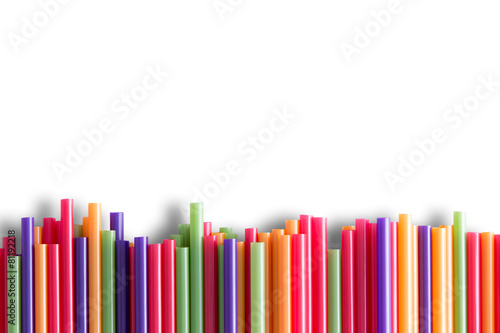 Rainbow colored plastic straws background pattern