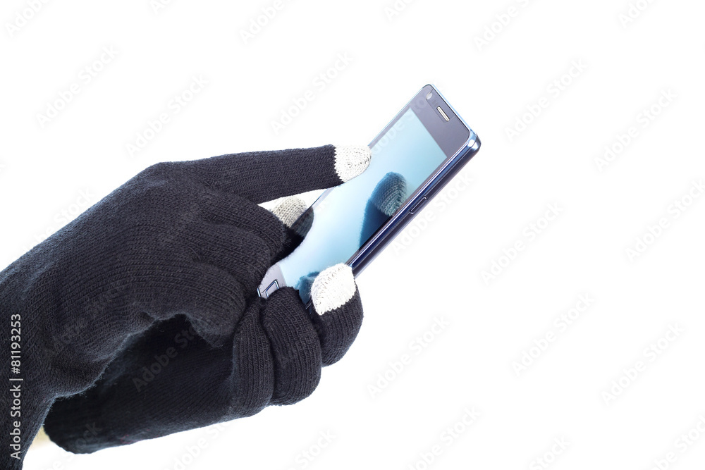 Closeup of woman hands with touchscreen gloves holding smart pho