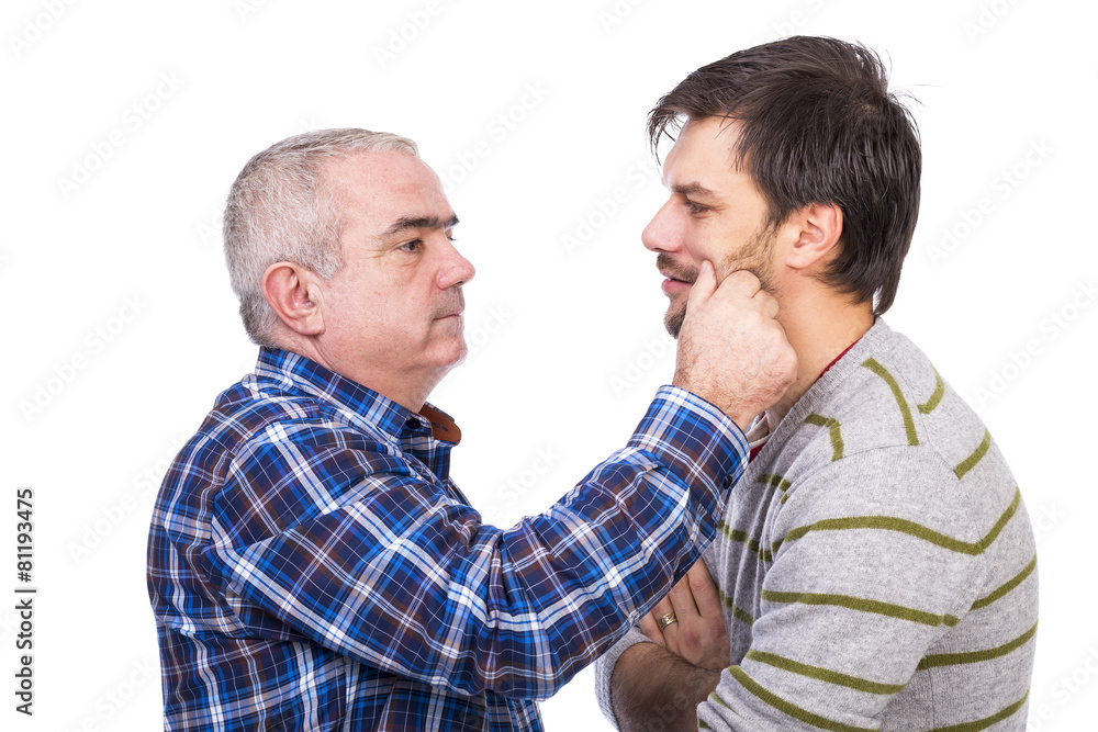 Portrait of father pinching his son cheek Portrait of father pinching his son cheek