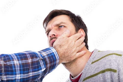 Obraz na płótnie Closeup of young man being slapped in the face w salonie