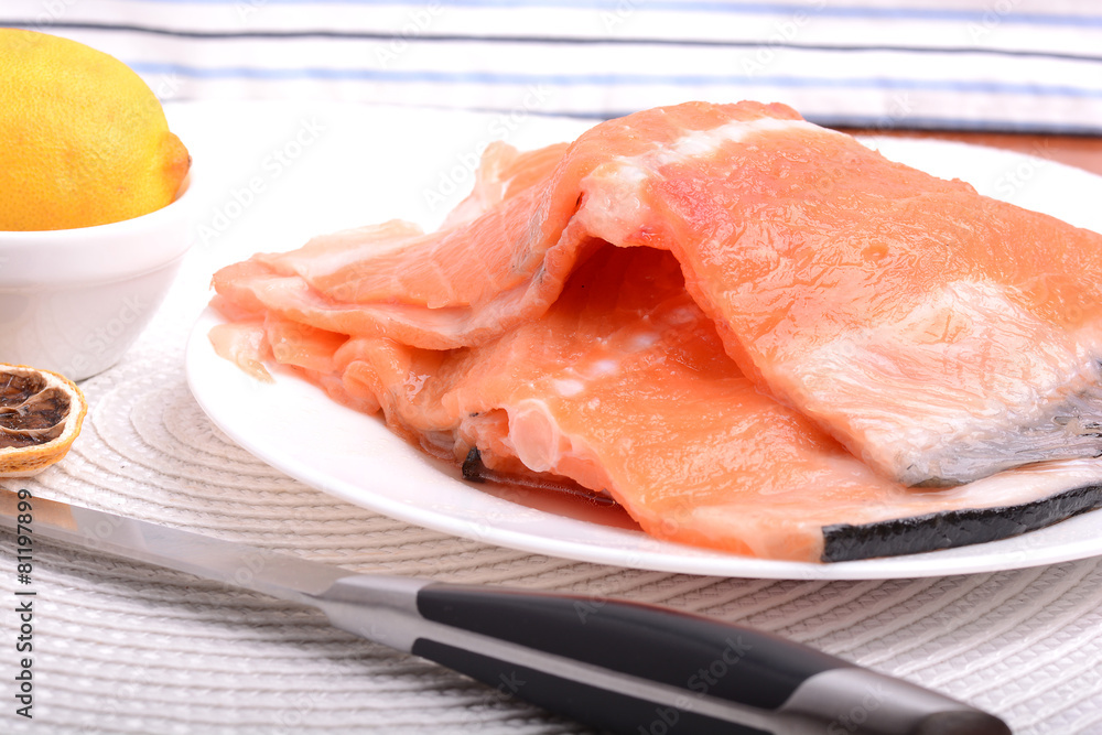 Fresh uncooked red fish fillet slices Fresh uncooked red fish fillet slices