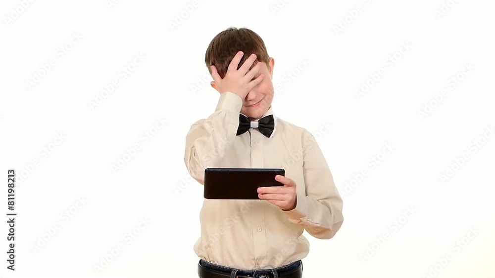 School boy playing something using tablet computer, on white School boy playing something using tablet computer, on white