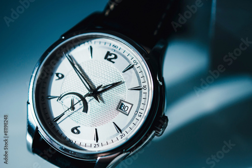 Luxury watch on blue background