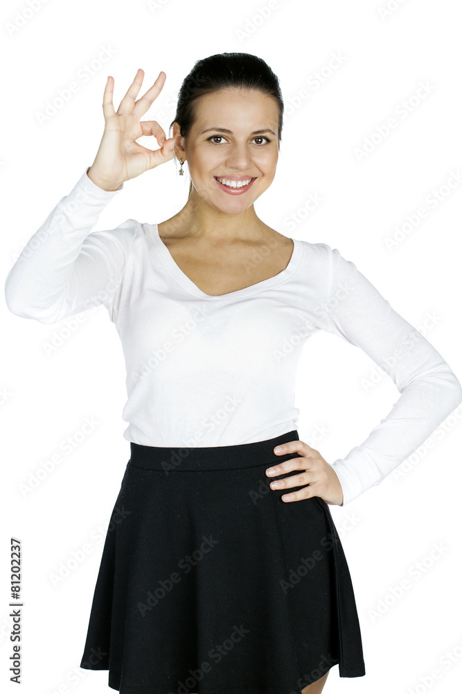 Portrait of a beautiful young woman showing OK Portrait of a beautiful young woman showing OK